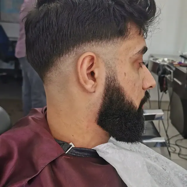 A crop and full beard at Tonys Barber Shop